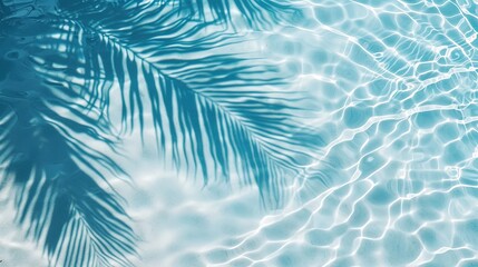 Fototapeta na wymiar palm leaf shadow on blue water waves, vacation and beauty care with copy space