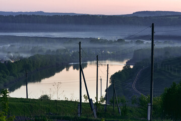 Evening landscape. View from the mountain to the river in the evening.