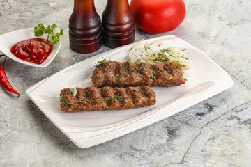 Kebab with beef served onion