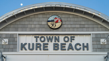 Facade of the Town of Kure Beach sign with emblem.