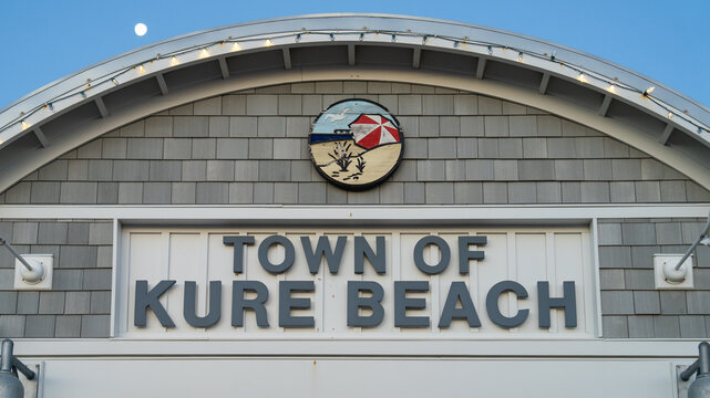 Facade of the Town of Kure Beach sign with emblem.