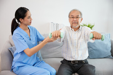 nurse or caregiver helping elderly patient to physiotherapist and exercise for rehabilitation at home