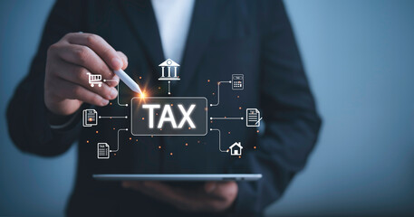 Businessman use tablet  to complete Individual income tax return form online for tax payment. Financial research,government taxes and calculation tax return concept. Tax and Vat concept. - obrazy, fototapety, plakaty