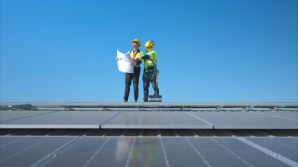 Both of technician working on a photovoltaic solar panels