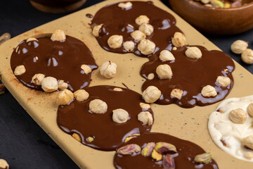 making homemade chocolate with different ingredients