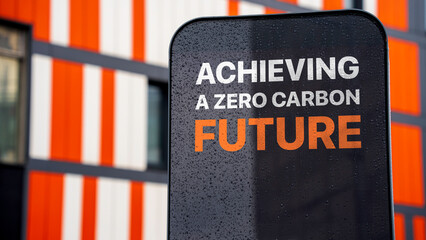 Achieving a zero carbon future on a sign in a city business district
