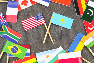The concept is diplomacy. In the middle among the various flags are two flags - USA, Kazakhstan