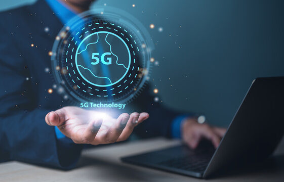 digital, innovation, micro, network, 5g, processor, internet, 5g wireless, wireless, intelligence. businessman one hand typing on keyboard, and another hand show 5g wireless technology network HUD.