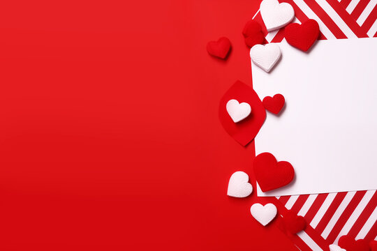 Crimson Harmony: Red and White Paper Composition Weaves Hearts and Stripes into a Festive Symphony