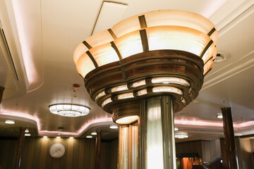 Impressive Artdeco Art Deco main atrium lobby staircase with grand stairs and chandelier on classic...