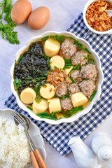Clear Soup with Bean Curd and Minced Pork and seaweed close up, thai food
