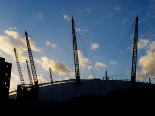 A silhouette against blue sky of the O2 Arena, formally the Milennium dome