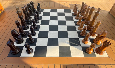 A large wooden chess set on the deck of Cruise liner Iona - 701418568