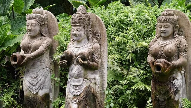 Hd slow motion footage of balinese fountain gods statue in Monkey forest, Ubud, Bali, Indonesia.
Mid angle, parallax movement.