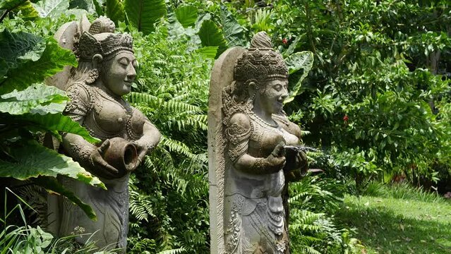 Hd slow motion footage of balinese fountain gods statue in Monkey forest, Ubud, Bali, Indonesia.
Mid angle, parallax movement.