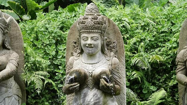 Hd slow motion footage of balinese fountain gods statue in Monkey forest, Ubud, Bali, Indonesia.
Mid angle, parallax movement.