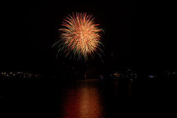 New Year's Eve fireworks over the channel in Marina del Rey, CA celebrate east coast midnight.
