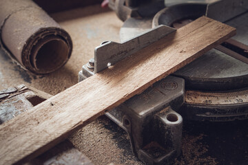 Close up of wood board and carpentry tool on the workshop table