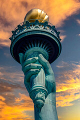 The torch of independence of the Statue of Liberty of the Big Apple and New York (USA) at dawn,...