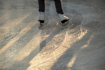 A girl skates on ice outdoors in December in Ukraine
