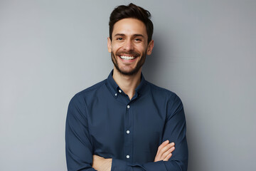 Handsome smiling business man in blue shirt isolated on gray background - obrazy, fototapety, plakaty