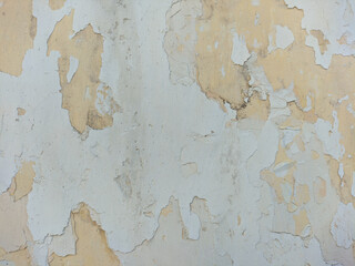 close up of old wall with peeling paint texture