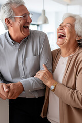 Overjoyed mature husband and wife laughing and hugging each other in the kitchen, happy senior couple having fun at home, smiling and enjoying romantic family weekend at home, senior love concept