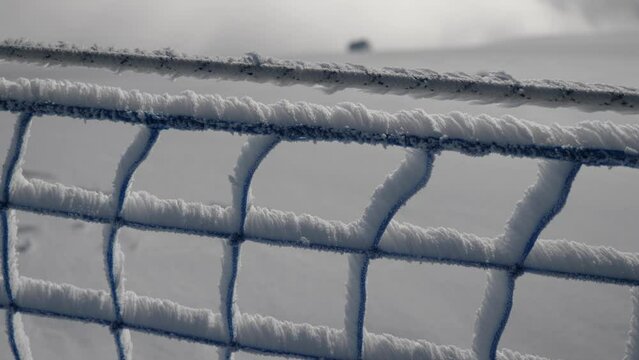 Fence covered by snow trough wind