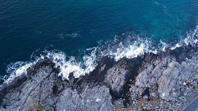 view of ocean waves crushing along the coast