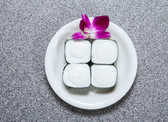 sago cake with coconut milk in pandanus leaf served in dish isolated on grey background top view of hong kong food