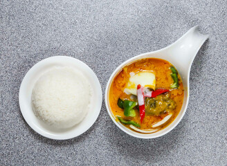 stewed beef flank yellow curry in thai style with rice served in dish isolated on grey background top view of hong kong food