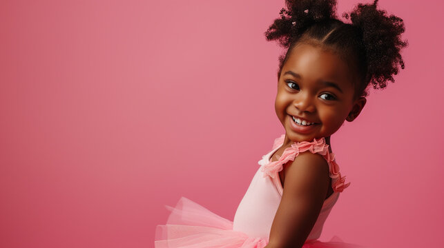 
candid portrait of a little african girl in a pink ballerina tutu posing isolated on a pink pastel background with copy space. concept - advertising of a ballet school, ballet class for children