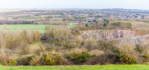 A panorama view from Croft Hill towards Thurlaston and Huncote Naturel reserve in Leicestershire, UK on a bright sunny day - obrazy, fototapety, plakaty