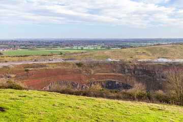 Fototapeta na wymiar A view from Croft Hill into Croft Quarry towards Huncote Nature reserve in Leicestershire, UK on a bright sunny day