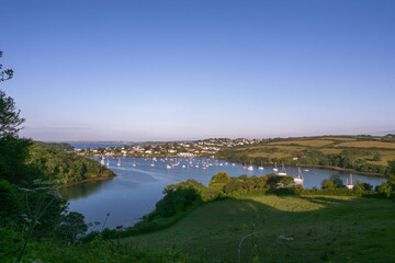 The Percuil River and St. Mawes, with many moored boats: Roseland Peninsula, Cornwall, UK - obrazy, fototapety, plakaty