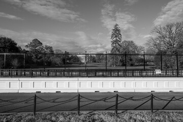 The White House behind fences in black and white