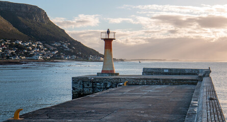 Kalk harbor lighthouse at sunset in False Bay in Capetown South Africa RSA