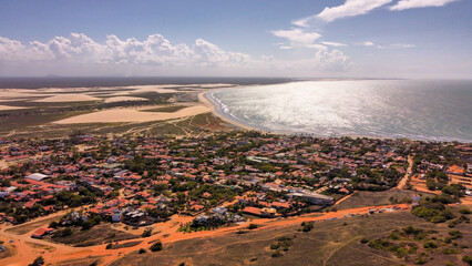 The city of Jericoacoara in Brazil in the middle of sand dunes and ocean front