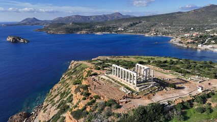Aerial drone photo of iconic archaeological site of Cape Sounio and famous Temple of Poseidon built...