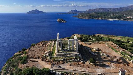 Aerial drone photo of iconic archaeological site of Cape Sounio and famous Temple of Poseidon built...