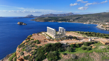 Aerial drone photo of iconic archaeological site of Cape Sounio and famous Temple of Poseidon built...