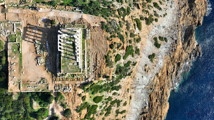 Aerial drone photo of iconic archaeological site of Cape Sounio and famous Temple of Poseidon built...
