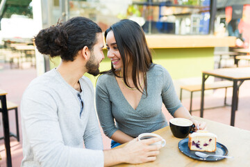 Hispanic couple having a romantic date in the coffee shop