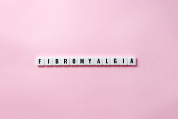 Word fibromyalgia on plastic blocks with letters. Disease concept. Selective focus, copy space