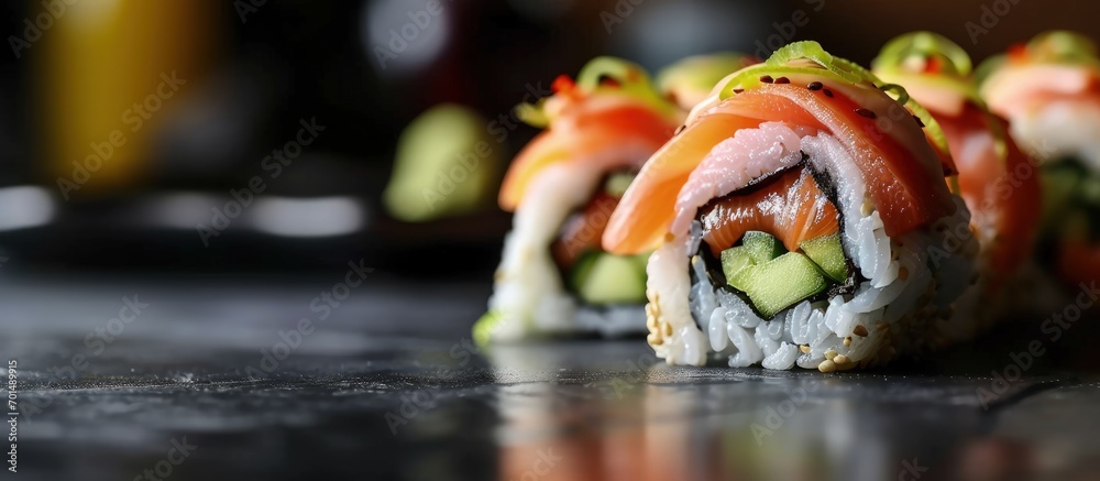 Poster sushi rolls close up with salmon avocado and cucumber. creative banner. copyspace image