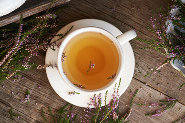 Heather or Calluna vulgaris flower tea in a pot, top view