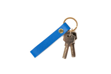 Leather keychain with key ring isolated on white background. Concepts for real estate and moving home or renting property. Buying a property. Mock-up keychain.Copy space.