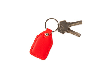 Leather keychain with key ring isolated on white background. Concepts for real estate and moving home or renting property. Buying a property. Mock-up keychain.Copy space.