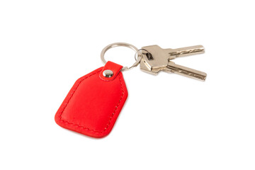 Leather keychain with key ring isolated on white background. Concepts for real estate and moving home or renting property. Buying a property. Mock-up keychain.Copy space.