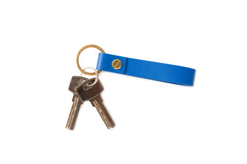 Leather keychain with key ring isolated on white background. Concepts for real estate and moving home or renting property. Buying a property. Mock-up keychain.Copy space.